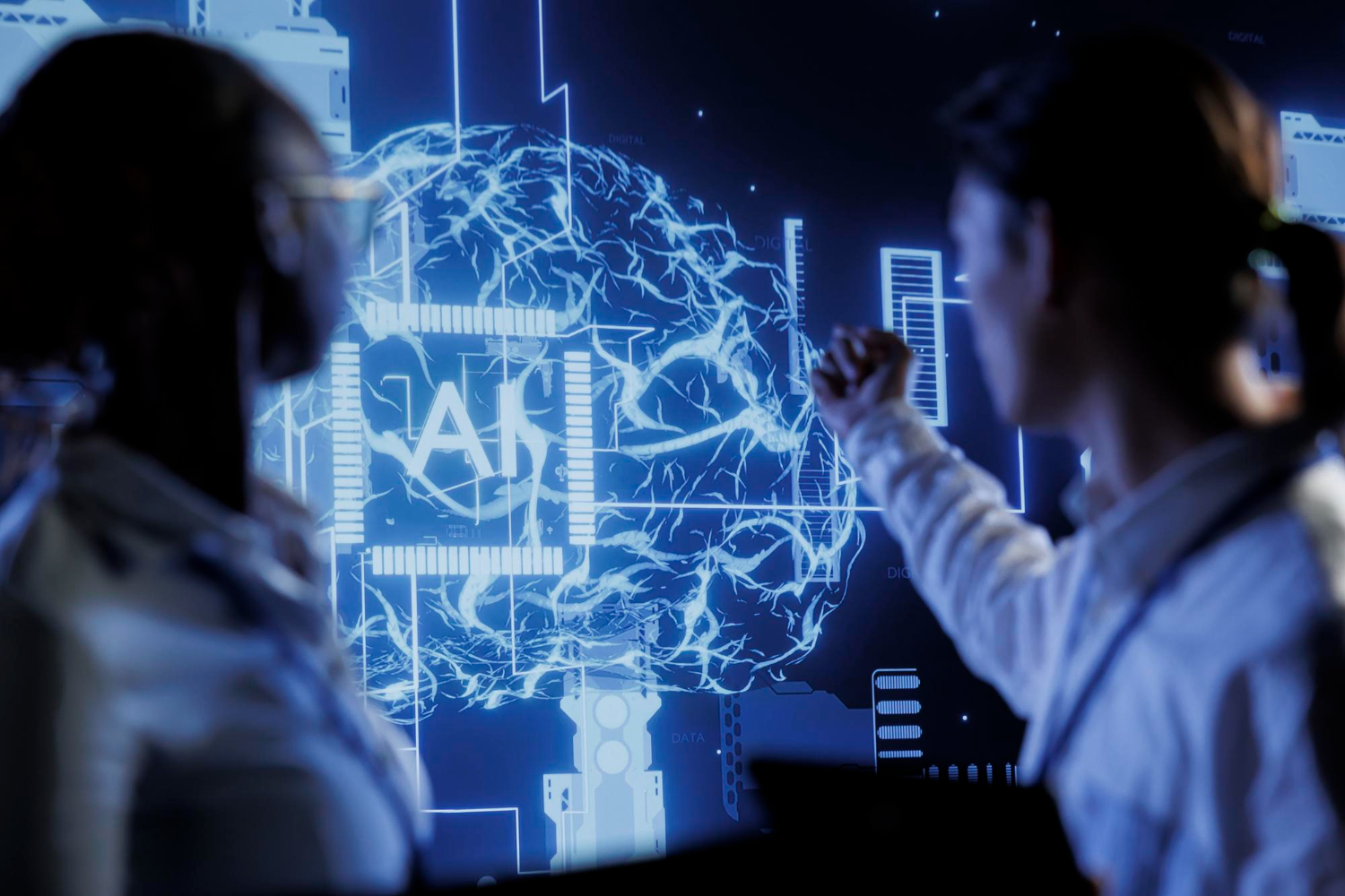 Two professionals analyzing AI-powered cloud resource optimization on a digital screen