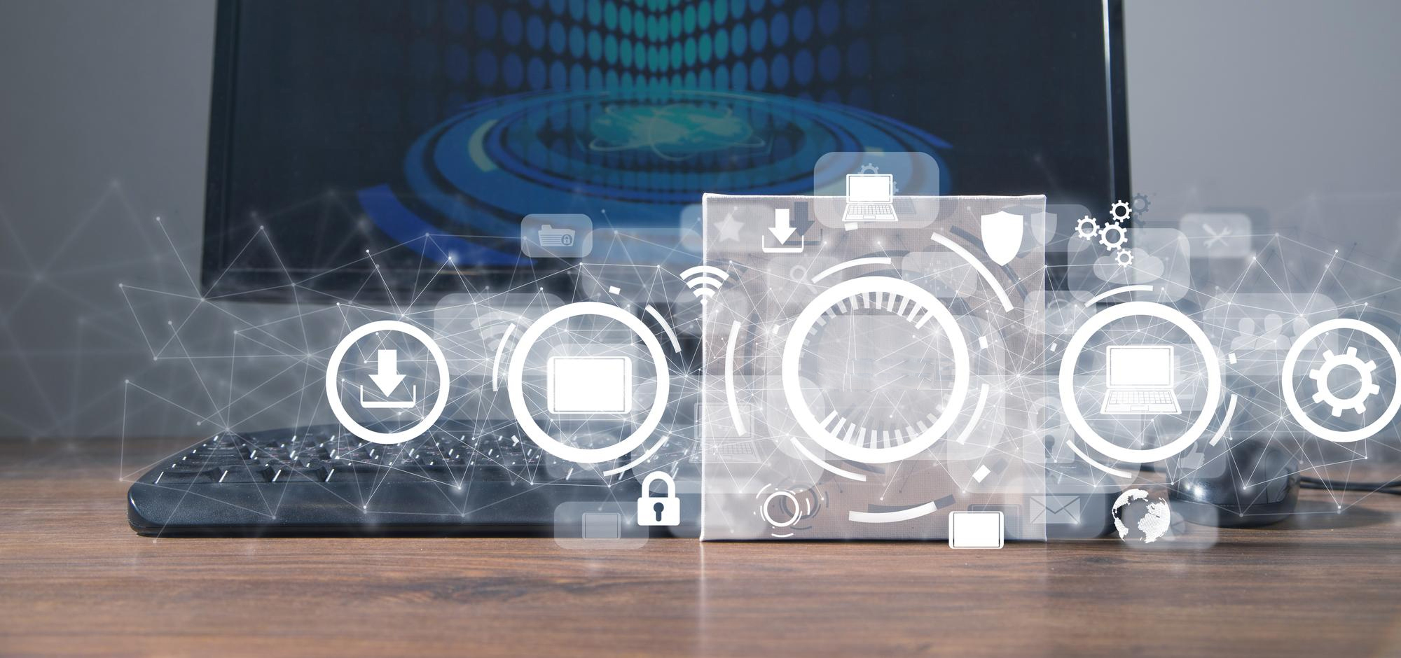 Laptop with holographic icons (screen, gear, lock, download) on DevOps monitoring dashboard.