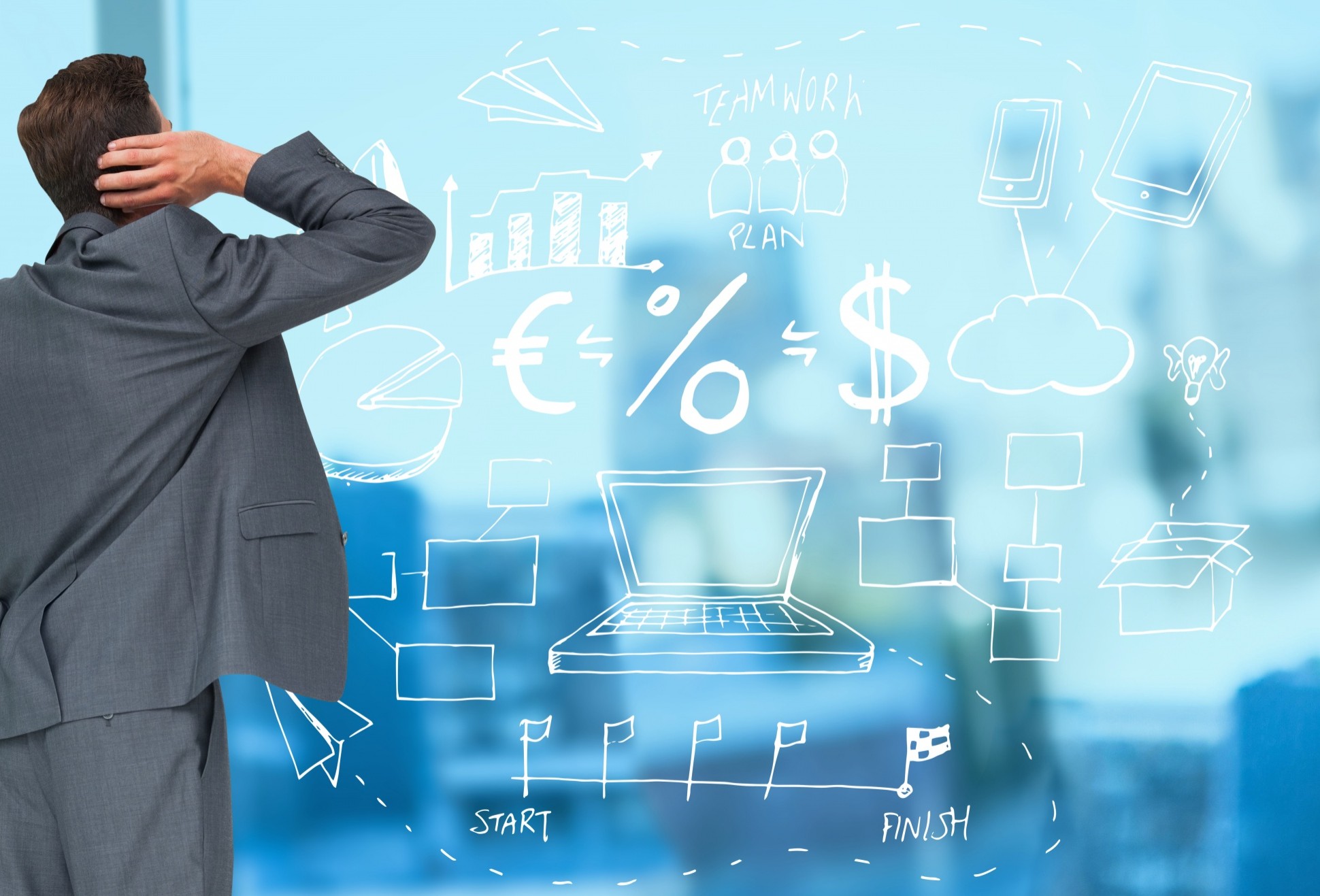 Businessman facing complex business plan sketch on wall